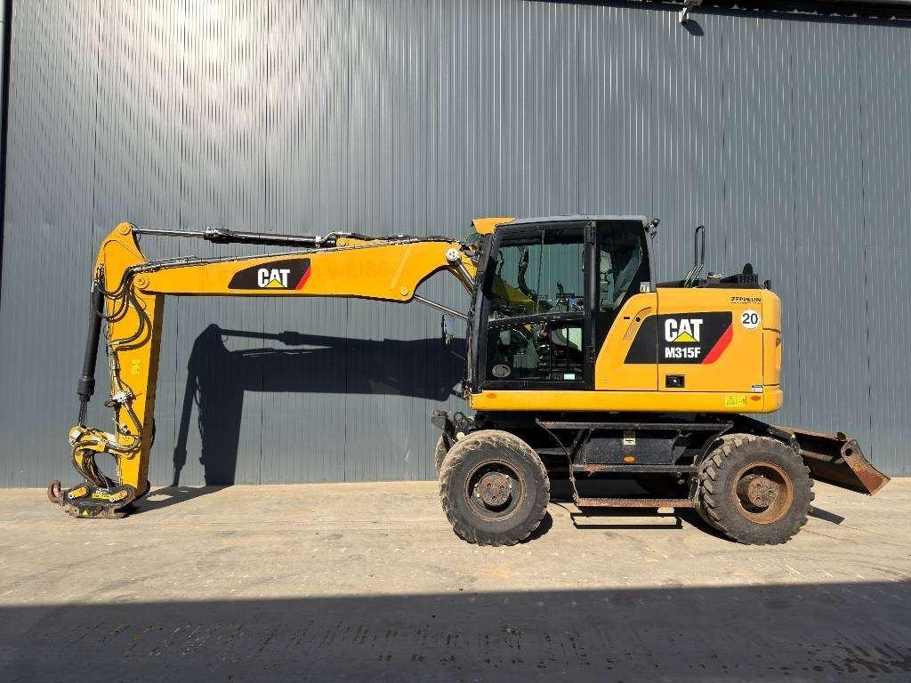 Caterpillar M315F - With OilQuick Foto 2