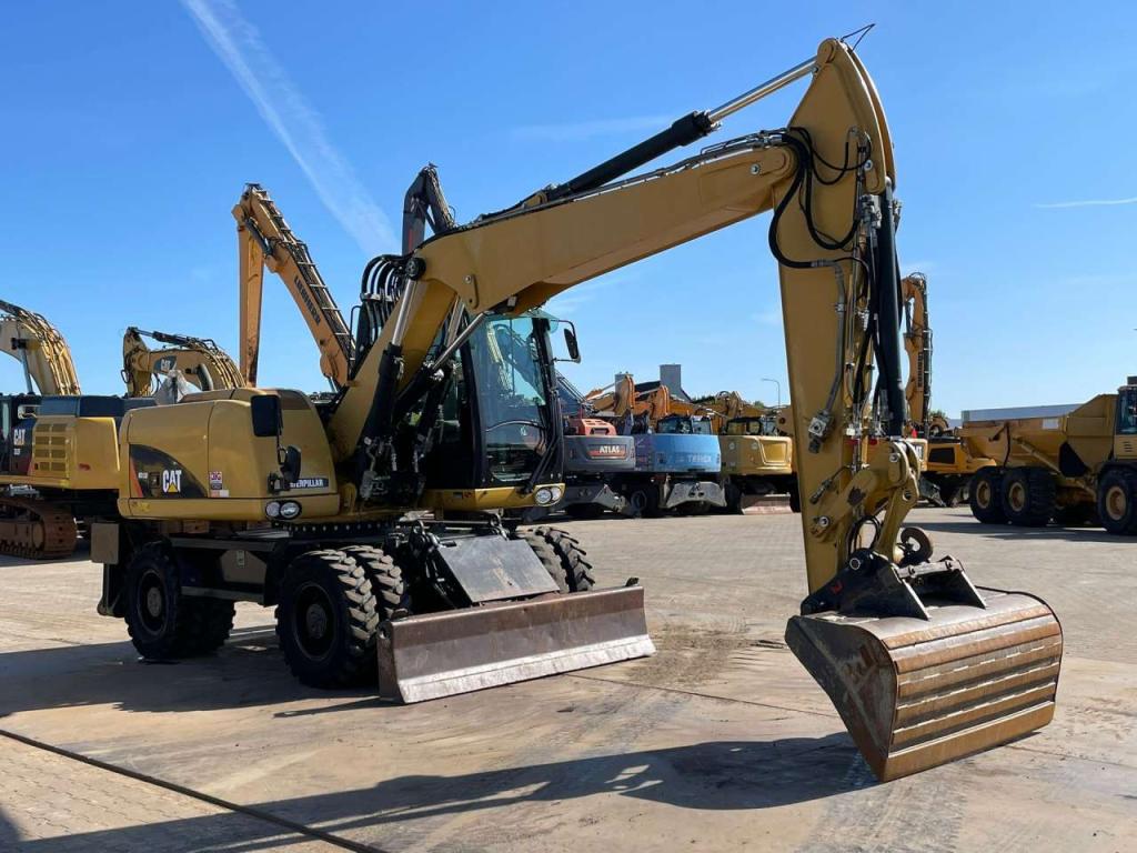 Caterpillar M313D VA - Outriggers + Blade Foto 10