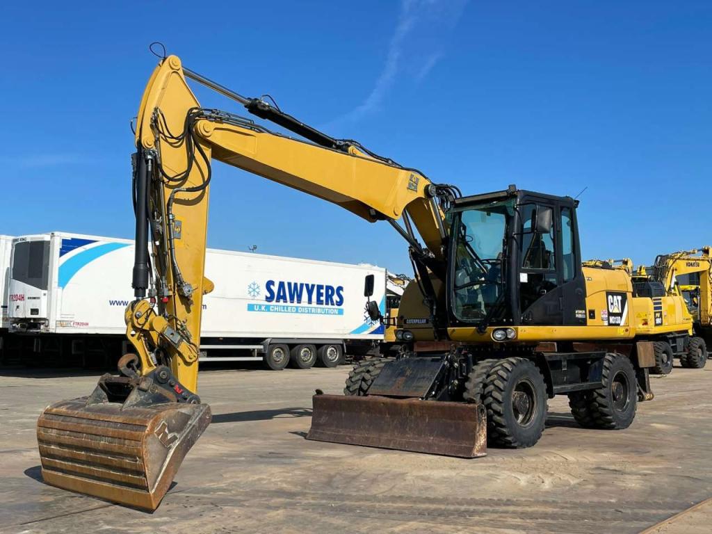 Caterpillar M313D VA - Outriggers + Blade Foto 4
