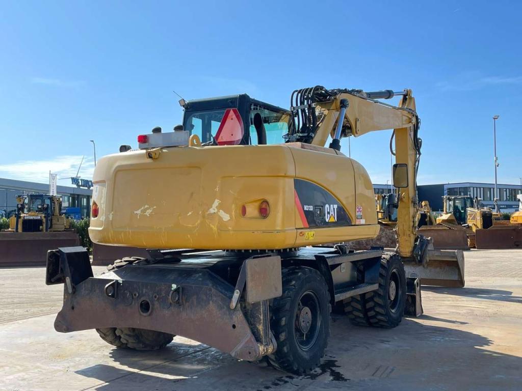 Caterpillar M313D VA - Outriggers + Blade Foto 8